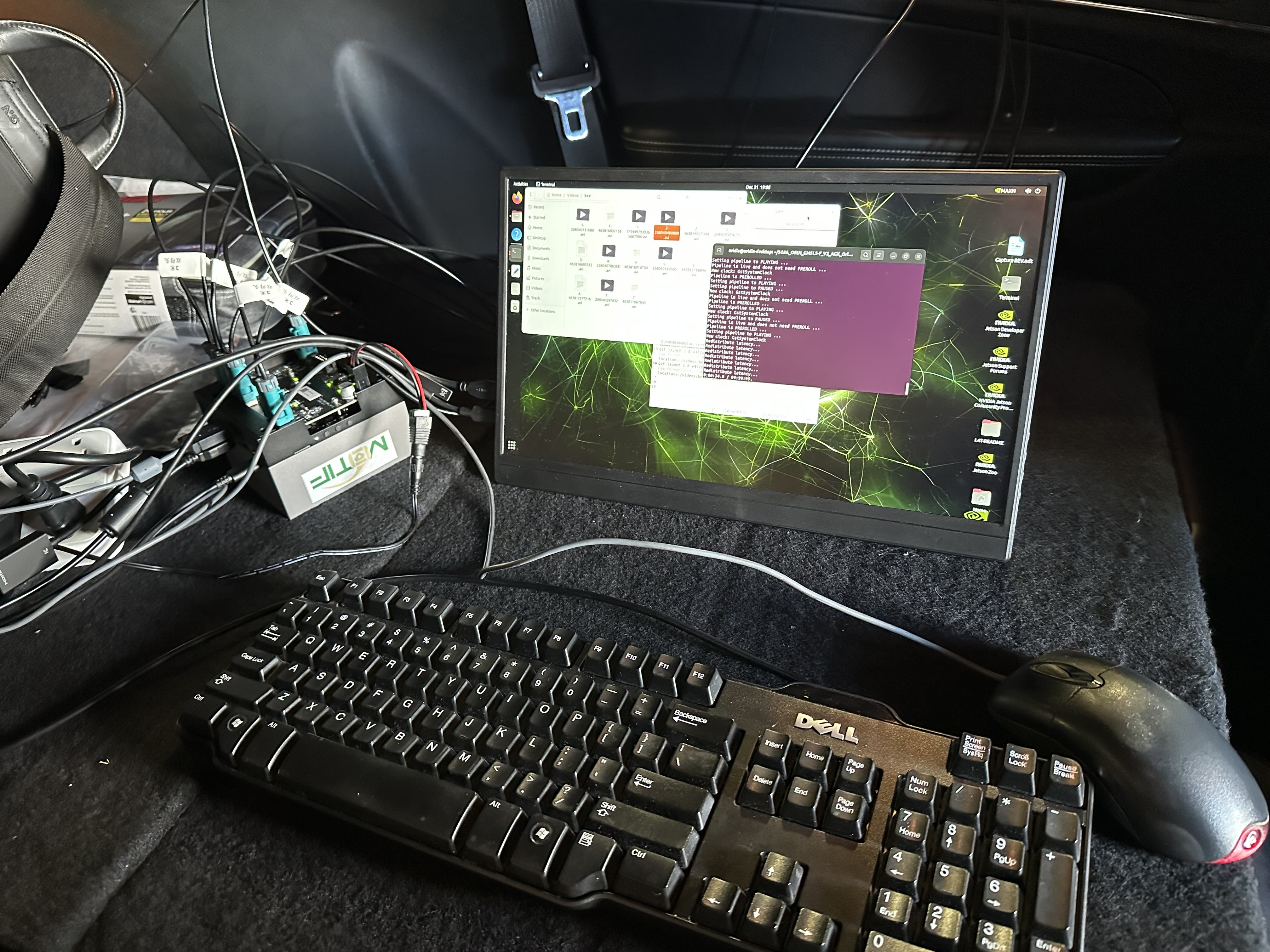 In-vehicle data collection rig with NVIDIA Jetson, portable monitor, keyboard and mouse set up in a MOTIF lab vehicle